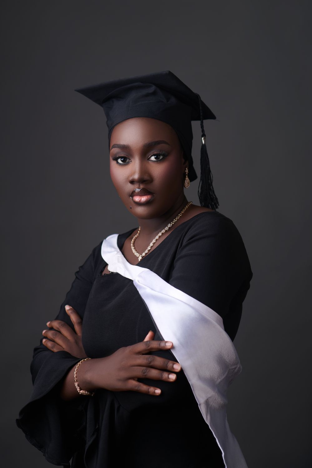 A proud Nigerian graduate in cap and gown